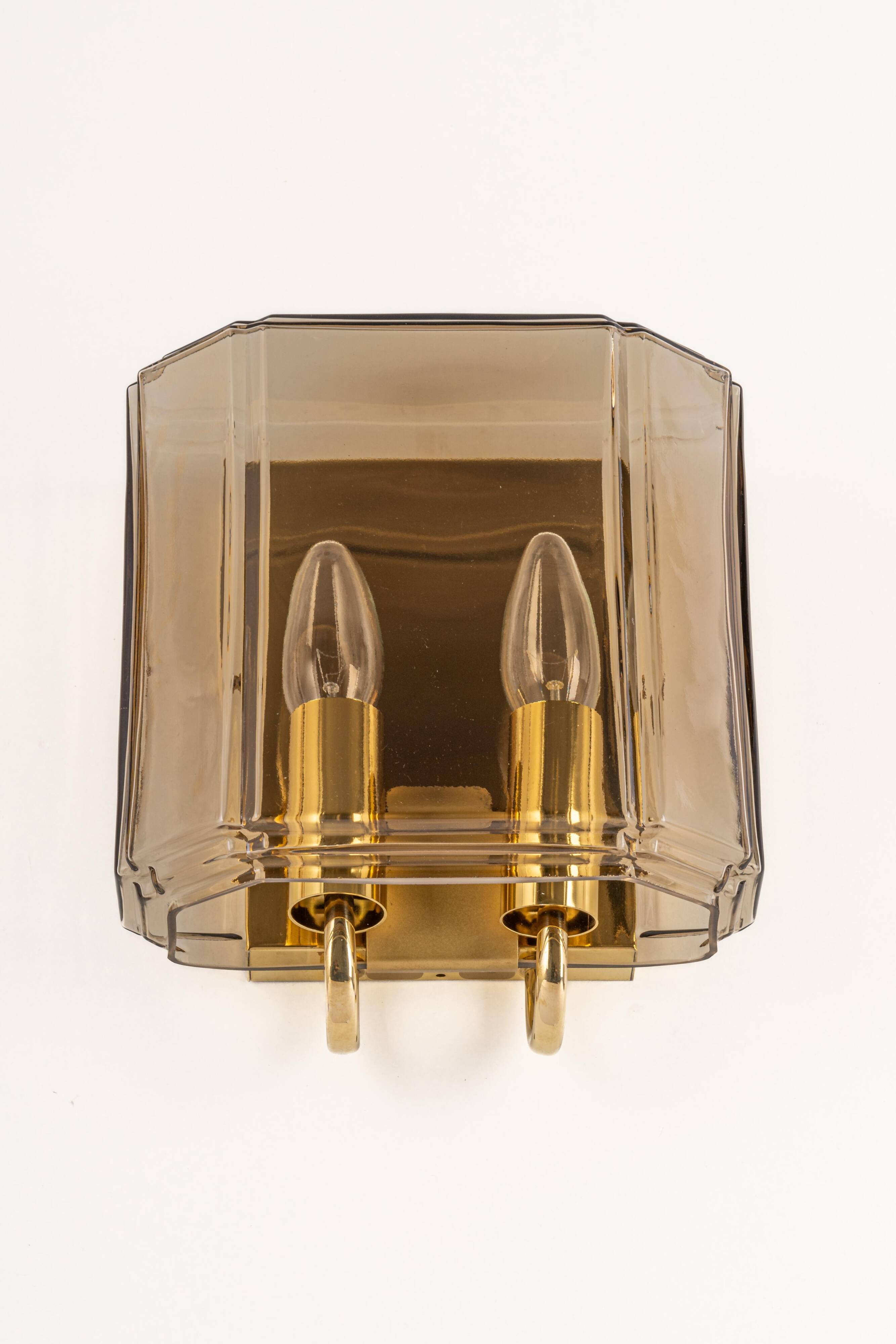 Large smoked glass wall sconces by Limburg, Germany.