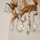 Hand-forged wall lamp gilded with gold leaf and crystals, Italy