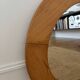 Round Scandinavian pine mirror from the 1970s.