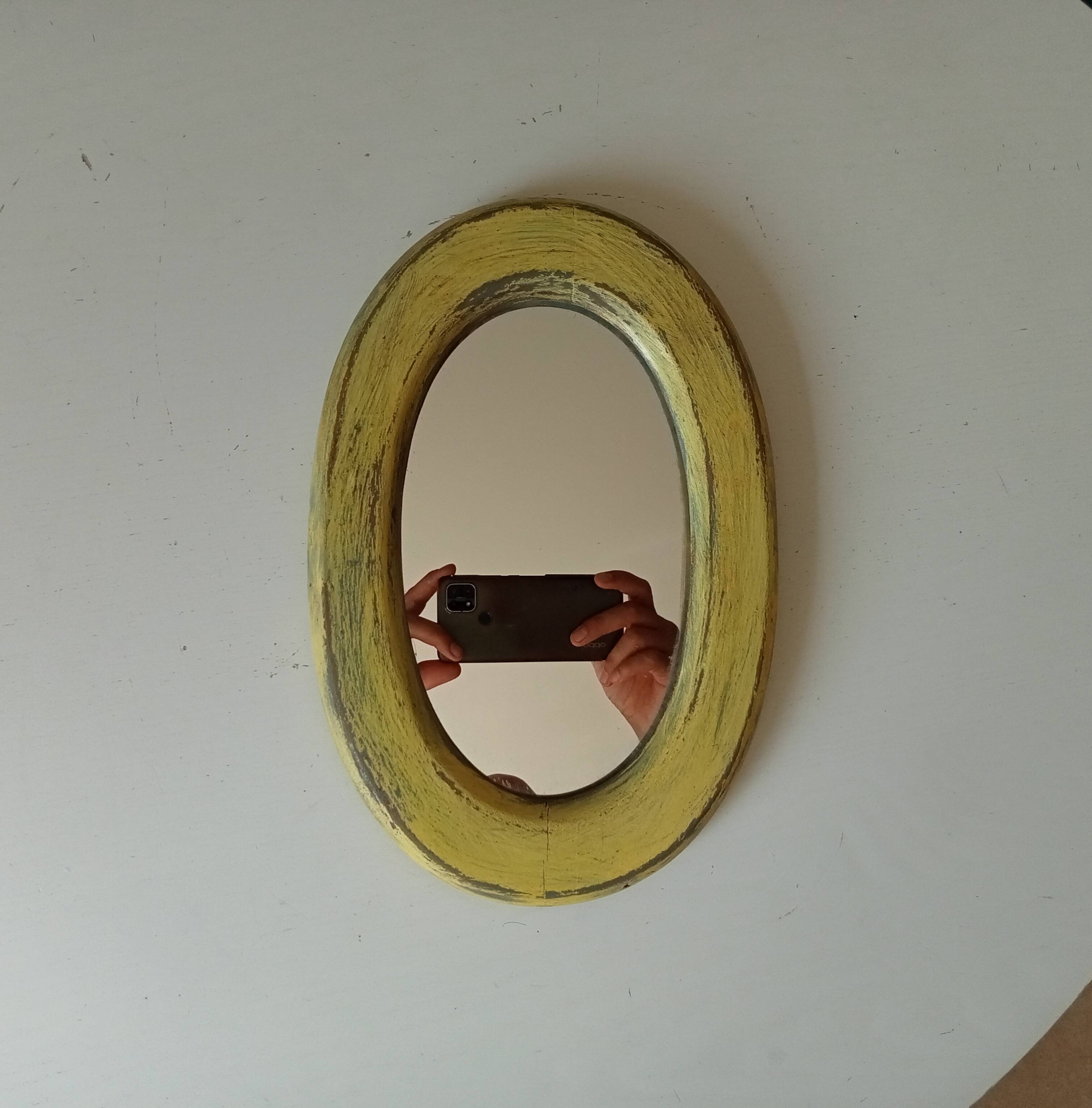 Small antique oval mirror