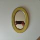 Small antique oval mirror