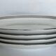 4 oval white porcelain dishes