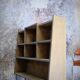 Asymmetrical shelf with lockers on feet
