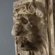 Old plaster tile with a fierce mask decoration, Italy, 19th century.