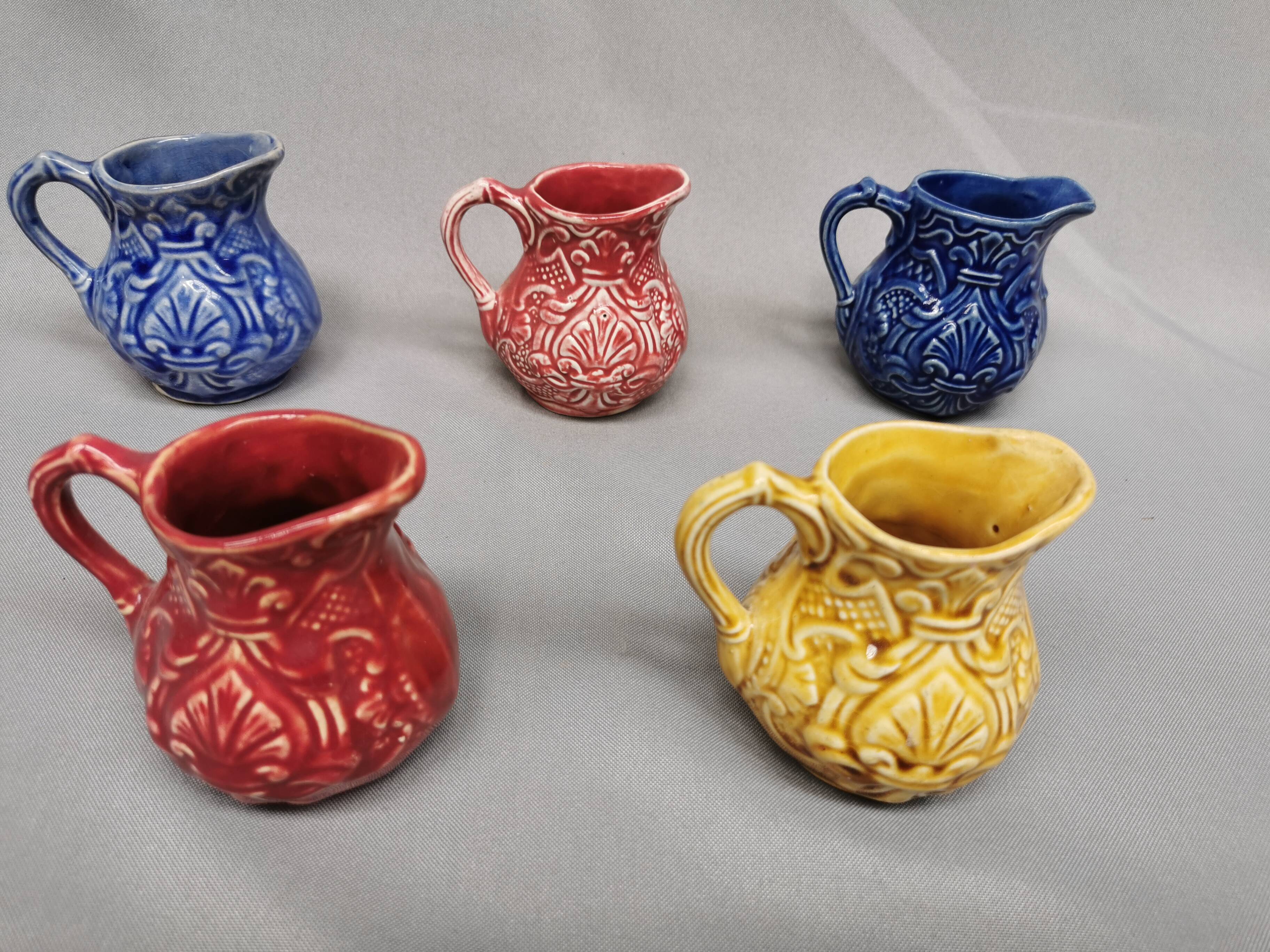 Set of 5 old onnaing barbotine jugs. creamer, sauce boat