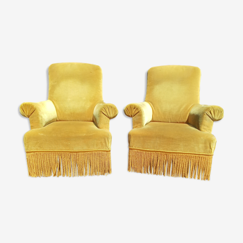 Pair of armchairs with golden velvet fringes