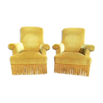 Pair of armchairs with golden velvet fringes