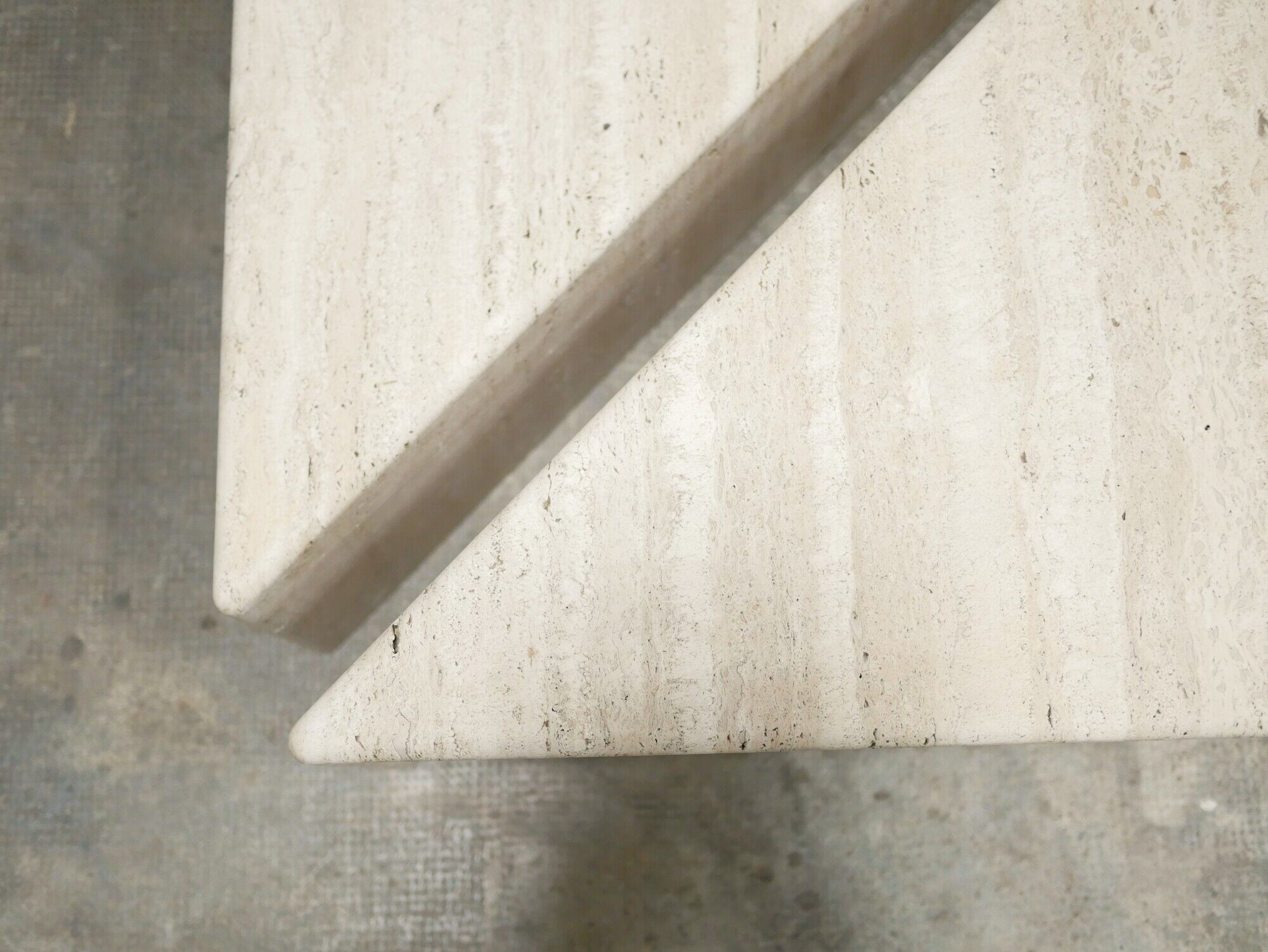 Series of 2 vintage travertine coffee tables published by Roche Bobois
