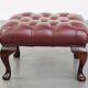 In very good condition elegant red/brown chesterfield ottoman made of cow leather