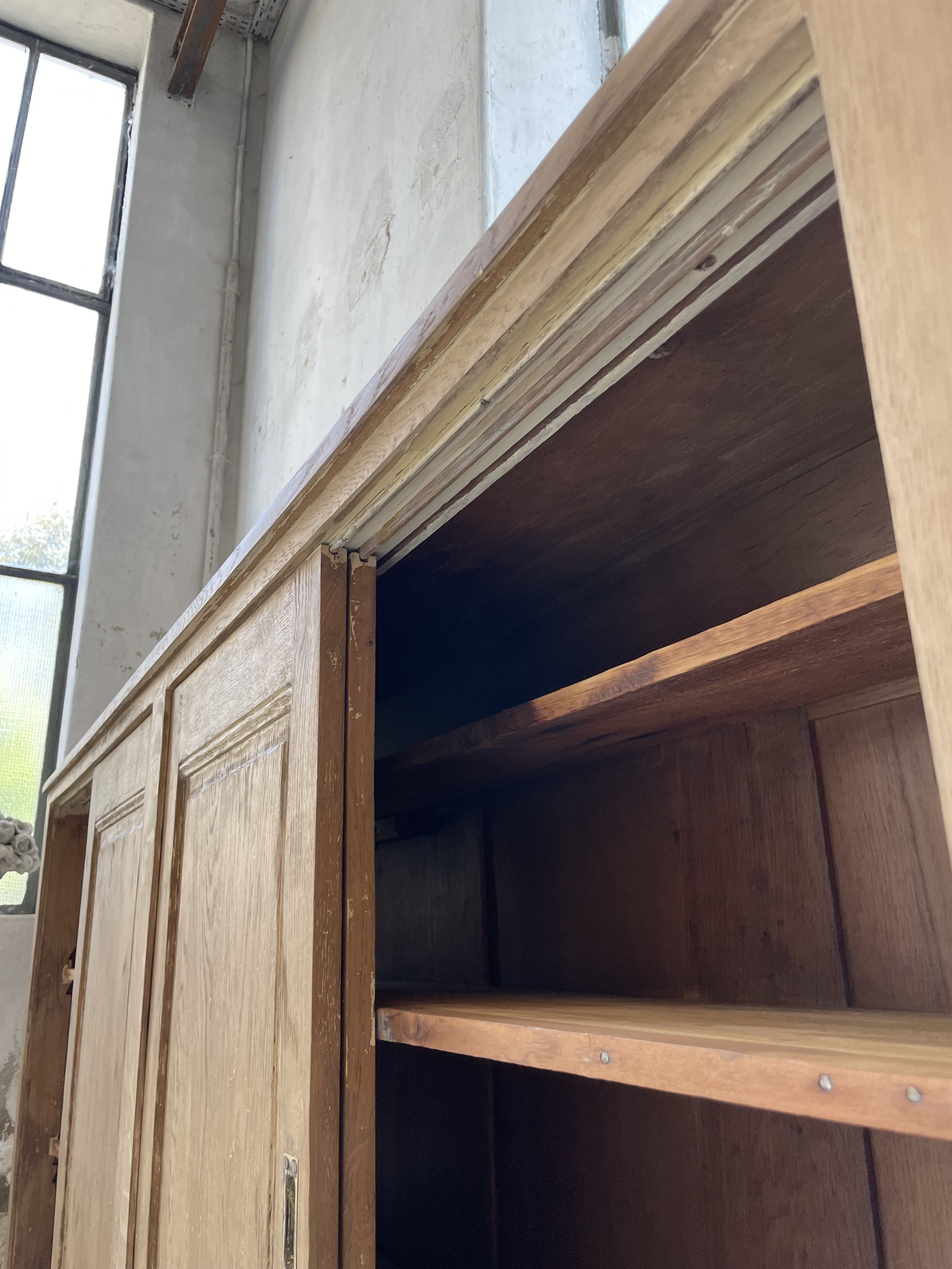 Large row of solid oak loom sliding doors