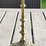 Baroque/Antique style torch candleholder, nineteenth, gilded bronze. Head motifs, volute arabesques