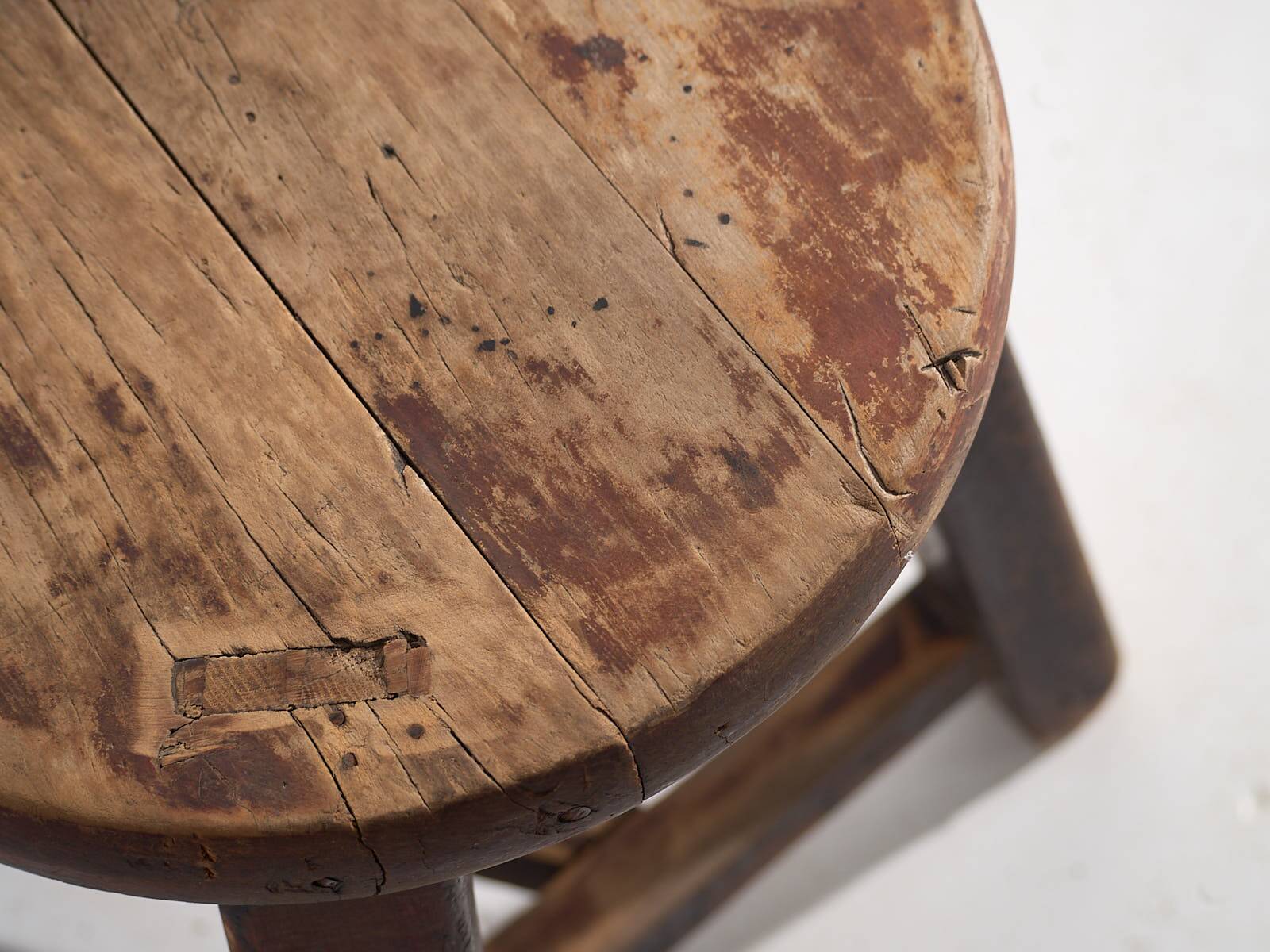 Antique round dark colored stool (c.1900)