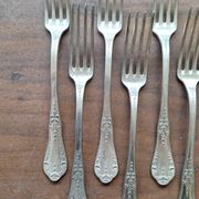 Set of silver metal forks