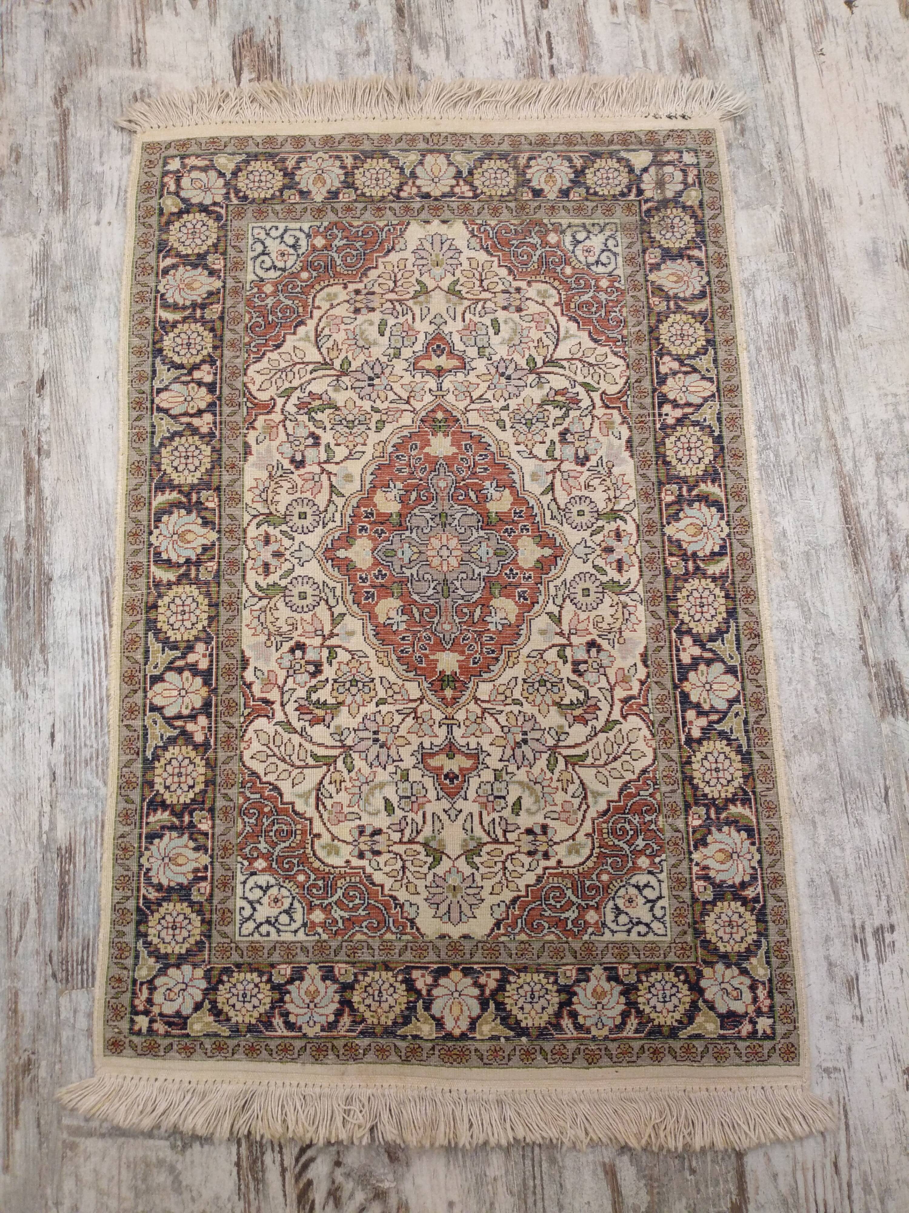 Handmade Persian wool and silk rug