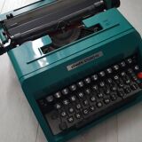 Studio 45 with his suitcase olivetti typewriter