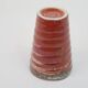 Small orange glazed ceramic cup