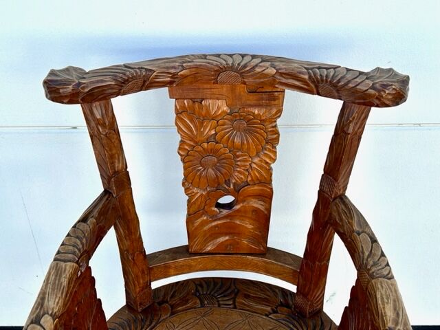 Hand stabbed teak armchair