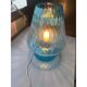 Light blue Murano-style glass with a balloton lamp.
