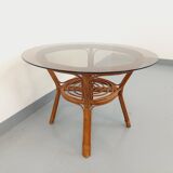 Vintage round smoked glass and rattan coffee table from the 70s