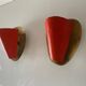 Pair of orange plexiglass and curved brass wall lights, 1950s, Germany