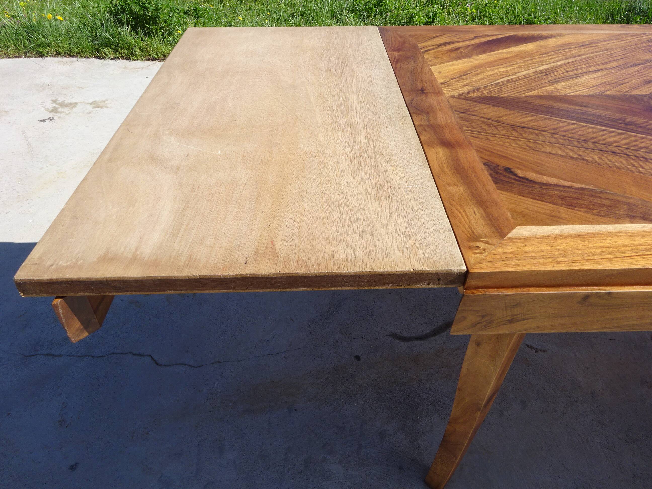 Antique solid walnut table with marquetry and extensions.