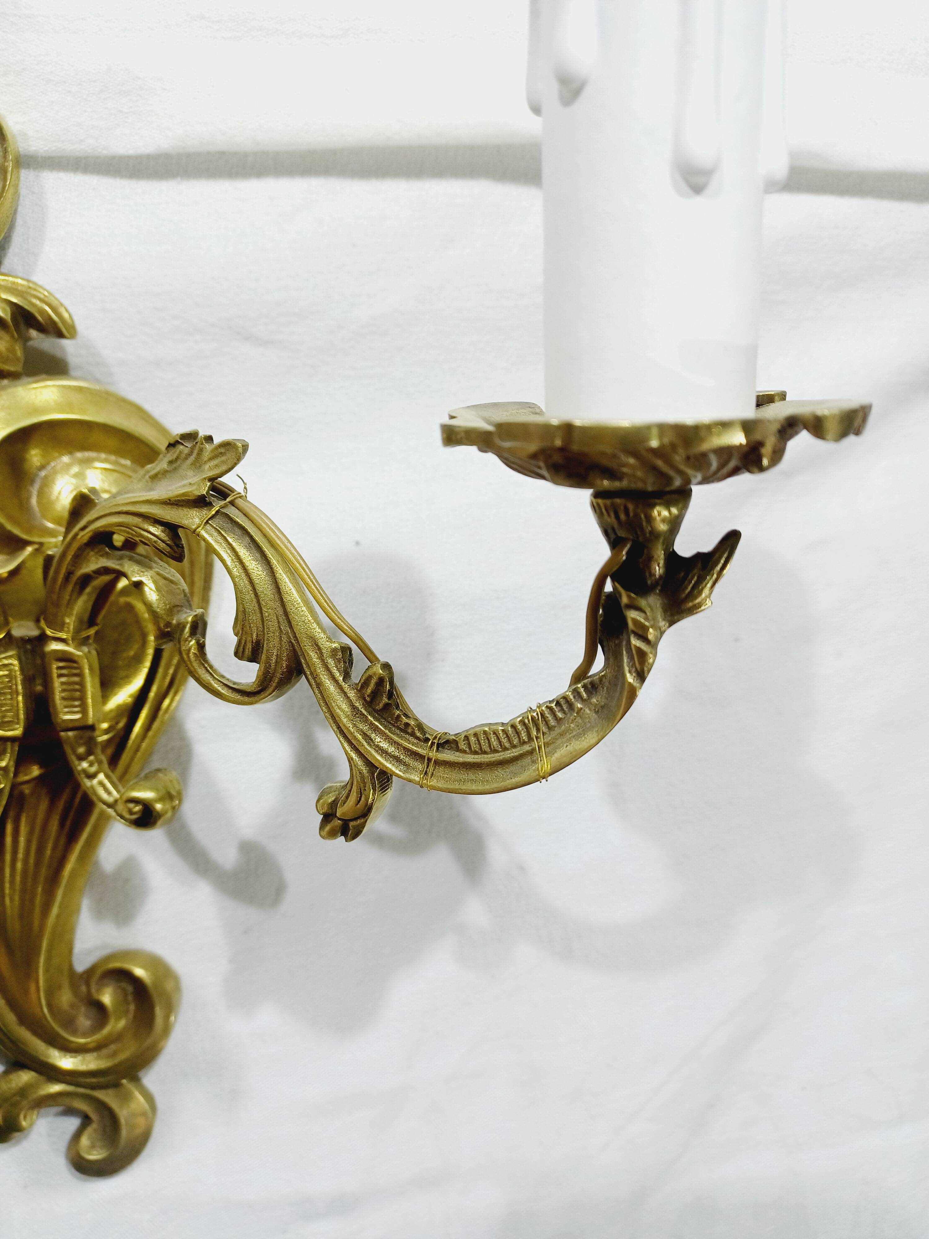 Pair of 2-light bronze wall lights, St. Louis XV