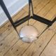 Vintage tripod metal side table with a blue brass bowl.