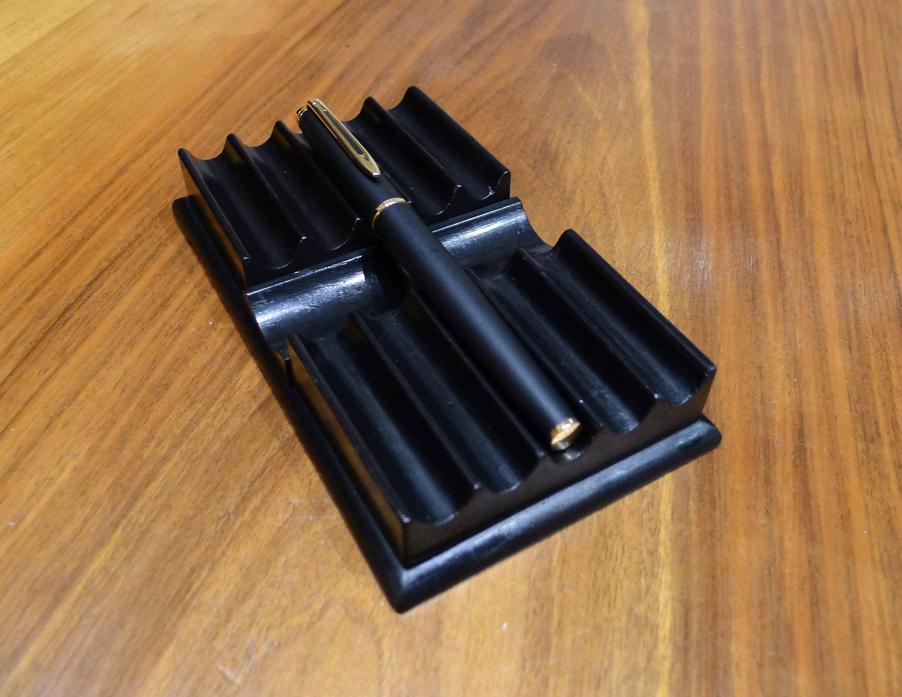 Old pen holder in black wood