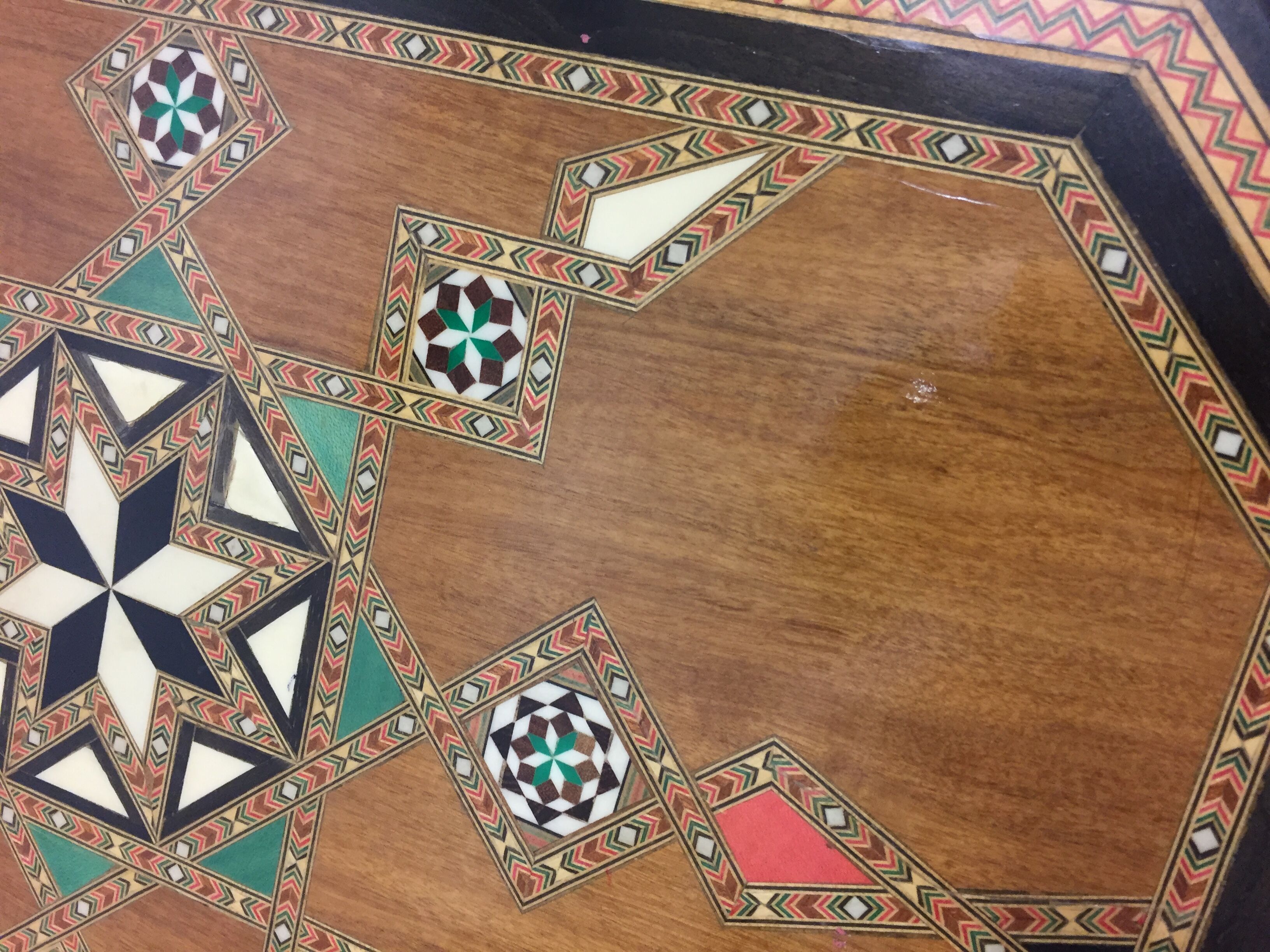 Old geometric marquetry top design'