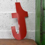 Industrial letter "t" in red metal