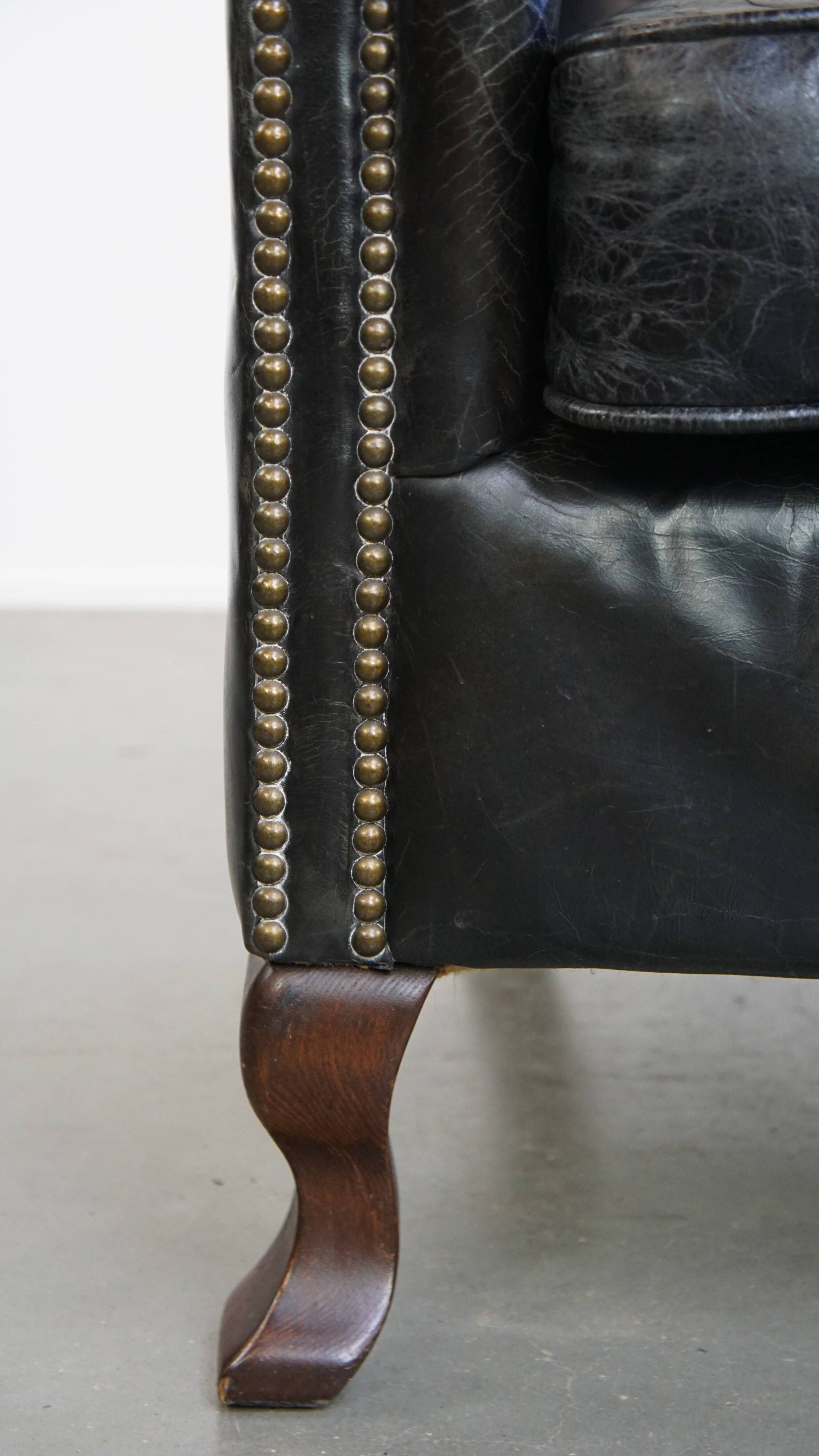 Black grained cowhide leather armchair