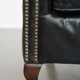 Black grained cowhide leather armchair