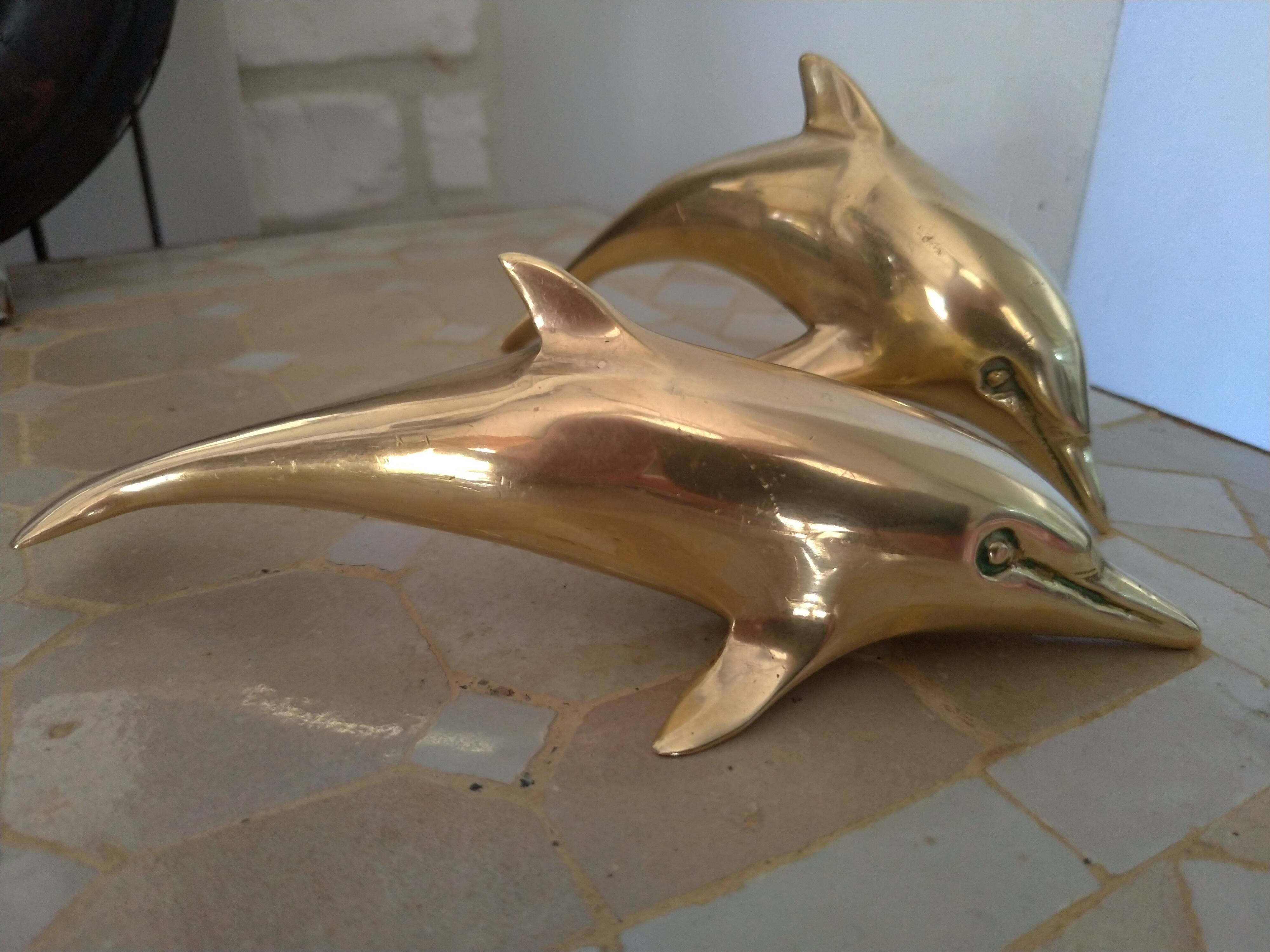 Brass dolphins