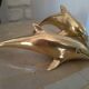 Brass dolphins