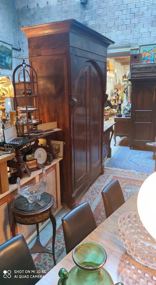 A walnut wardrobe with marquetry and boxwood stringing, dating from the Consulate period, circa 1810.
