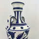 white amphora-style vase with hand-painted blue patterns