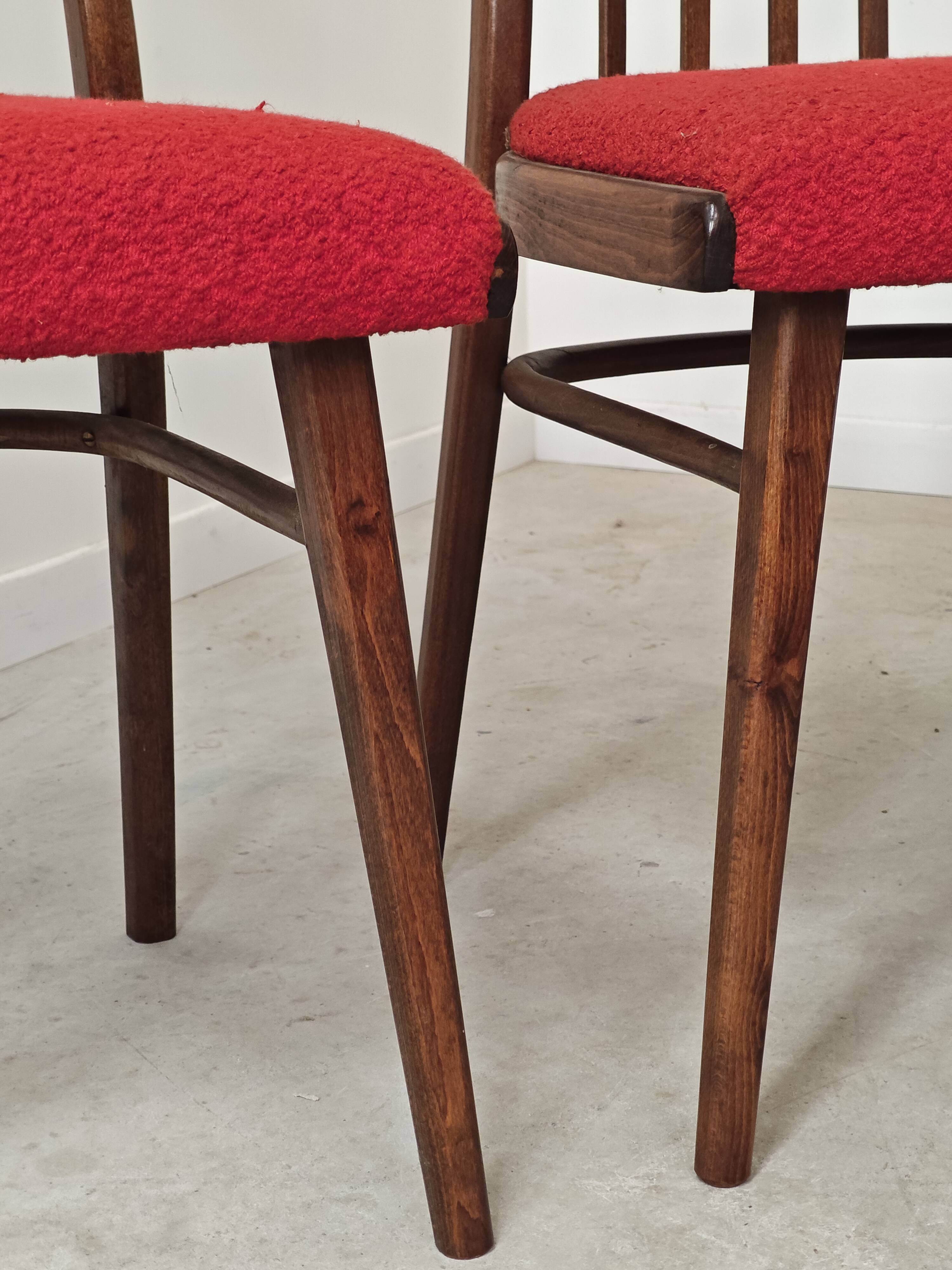 Set of 4 red dining chairs by Antonin Suman for Interier Praha.