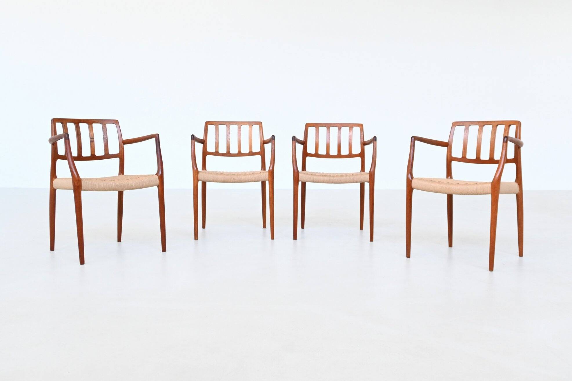 Niels Otto Moller model 66 armchairs teak and paper cord Denmark 1974