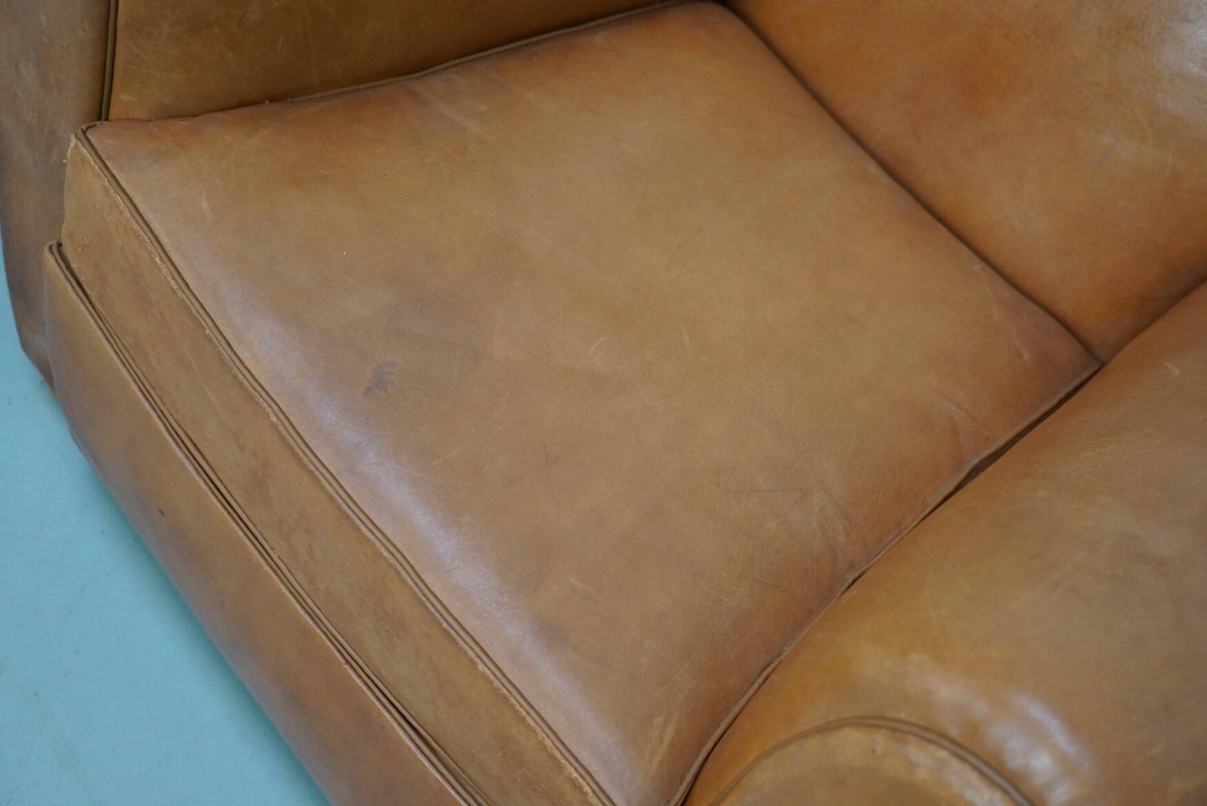 Pair of French club chairs with moustache back in cognac leather, 1950s