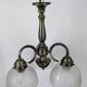 Antique Art Deco chandelier with 3 arms in patinated metal and ribbed glass.