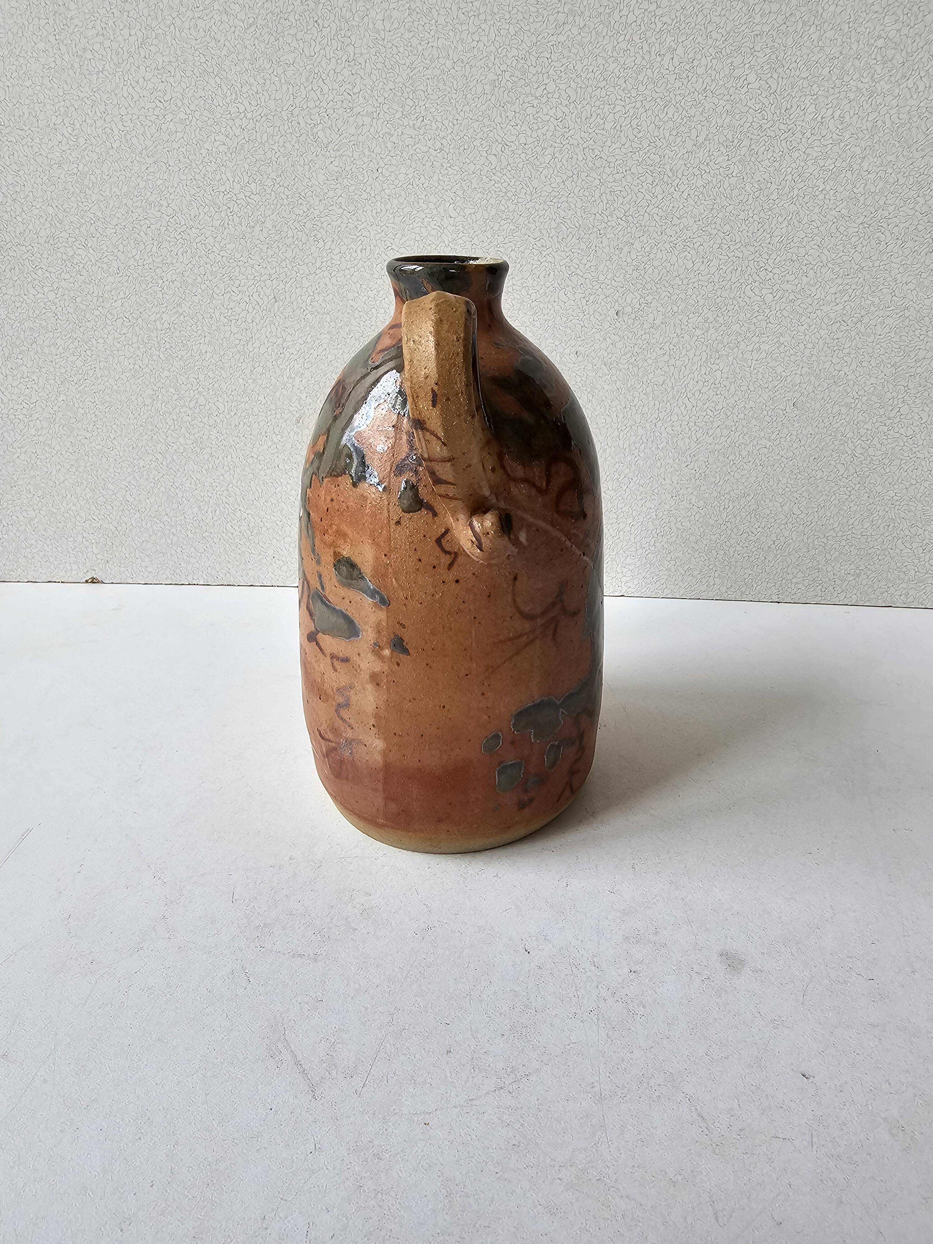 Ceramic handle soliflore vase with an unidentified signature