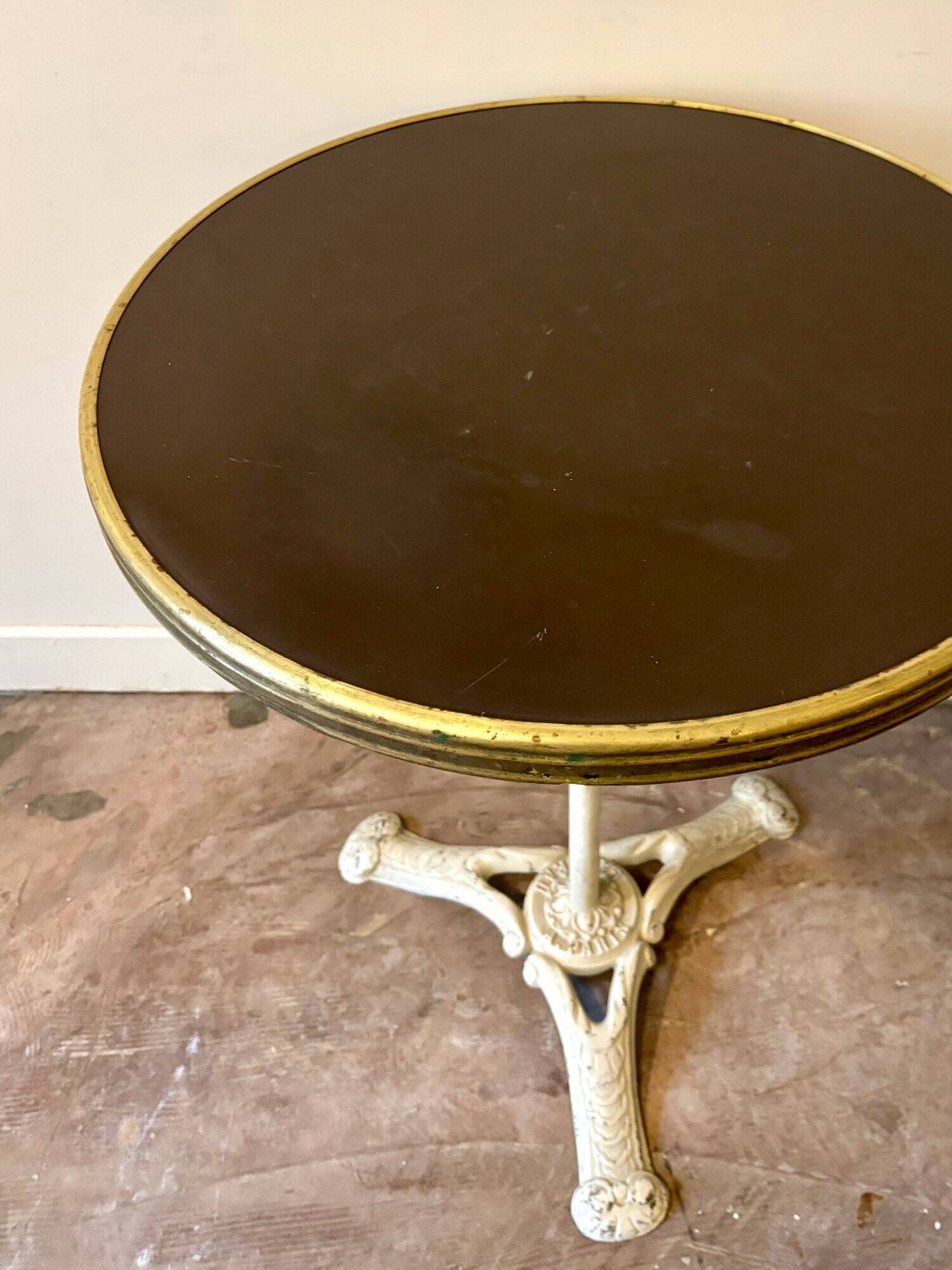 Bistro table in gray cast iron and brown melamine