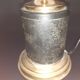 Antique lamp in black and gold metal with its lampshade