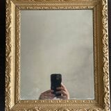 Old small baroque mirror with mercury tin