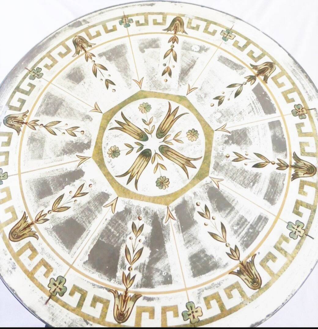 Round table from the 1940s, wrought iron and eglomisé glass.