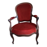 Bergère armchair in Napoléon III style, wood and burgundy velvet.