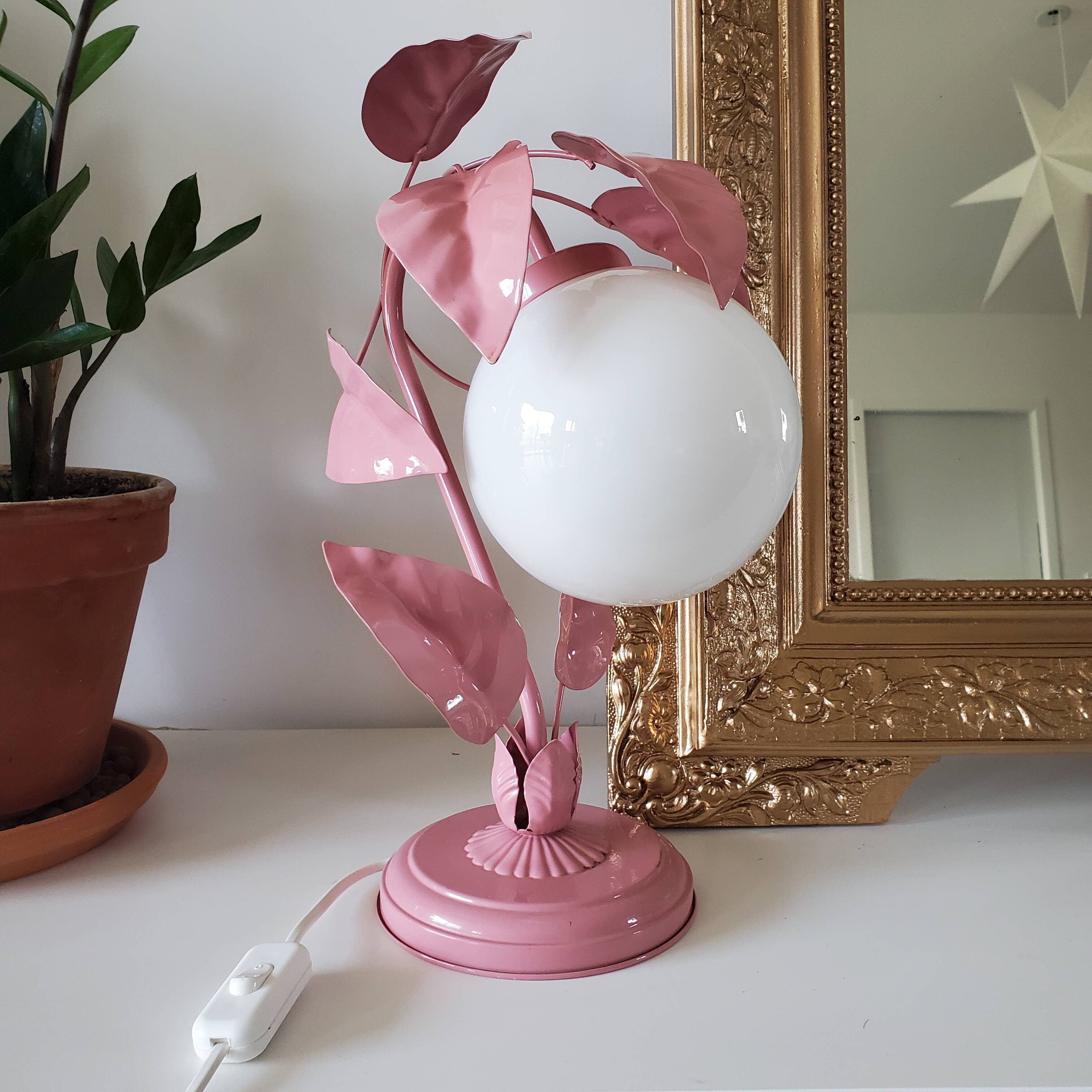 Opaline bedside lamp and pink leaves