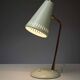 Adjustable table lamp in patinated brass and green metal