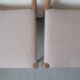 Pair of Scandinavian teak chairs sitting beige gray fabric