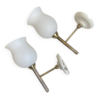 Pair of brass torch wall lights with white opal glass and porcelain